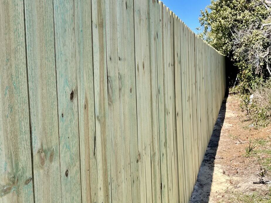 Stockade residential wood fencing in the Pensacola, Florida area.