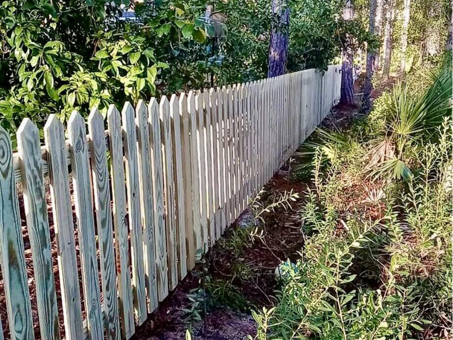 Picket style residential wood fencing in the Pensacola, Florida area.