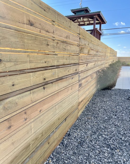 Beautiful example of a Horizontal style wood fence installed in Pensacola, Florida