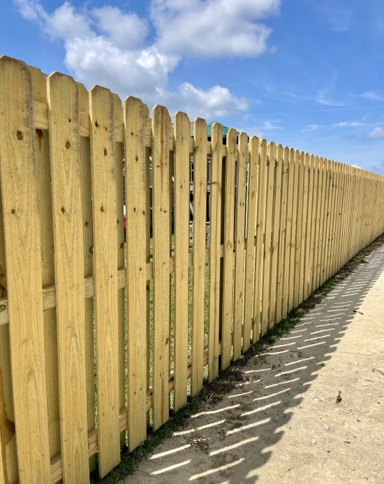 Beautiful example of a shadow box style wood fence installed in Pensacola, Florida