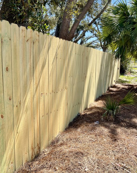 Beautiful example of a Stockade Style Wood Privacy fence installed in Pensacola, Florida